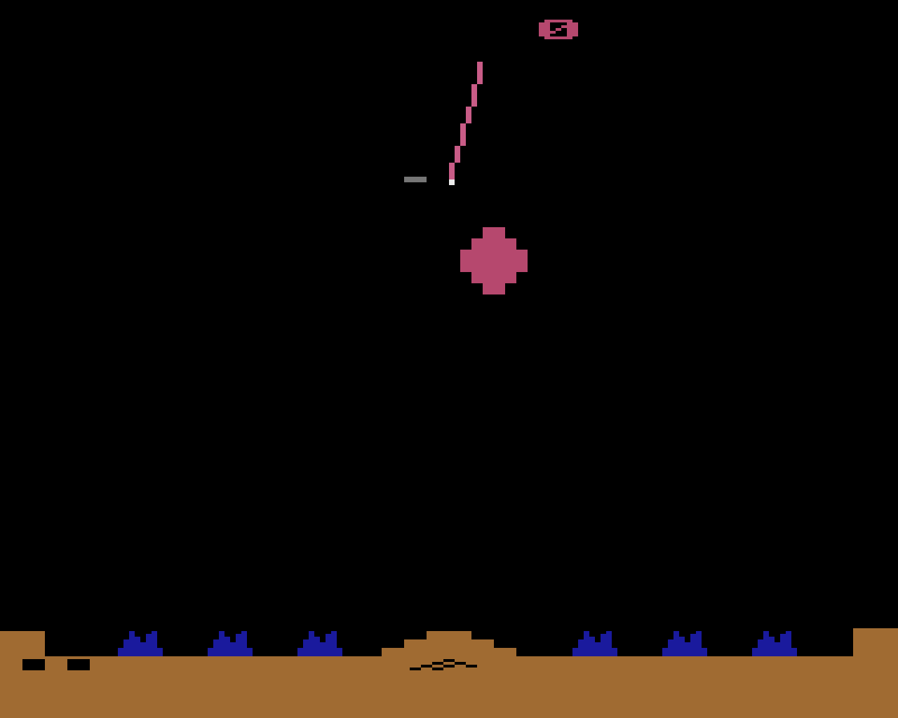 Asteroids on the 2600: a handful of moving shapes that still reads instantly, decades later.