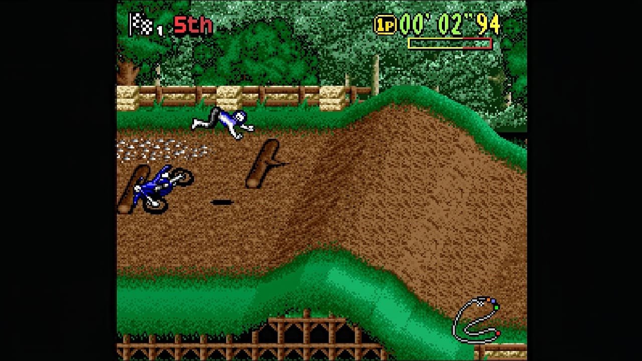 A rider thrown clear of his bike after hitting a log, with the race timer and track map on screen. Image: Ratalaika Games.